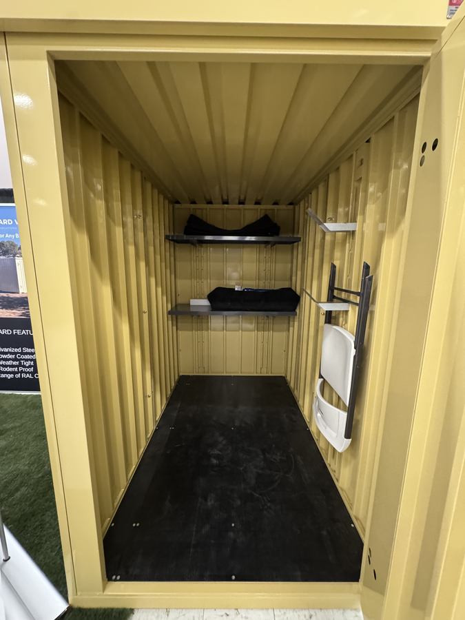 Steel unit interior with shelving and seating