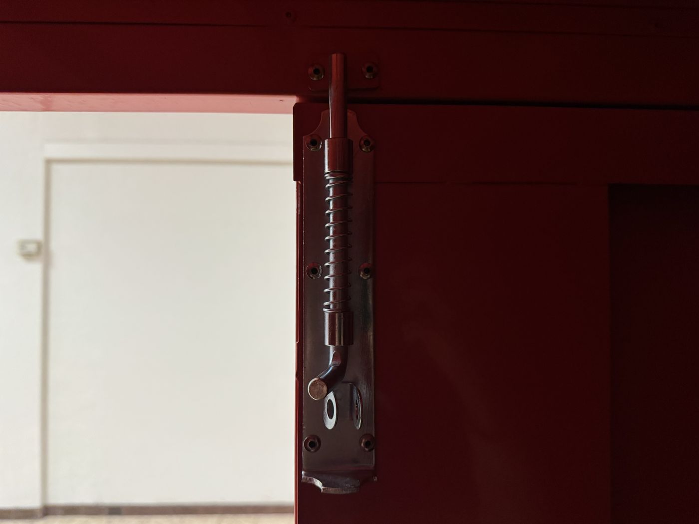 A spring-loaded drop bolt locks the second door tight.