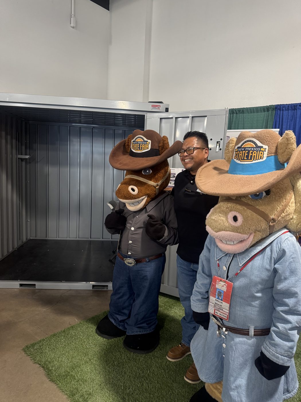 My Yard Vault 4 Corners booth at the New Mexico State Fair with the fair mascots